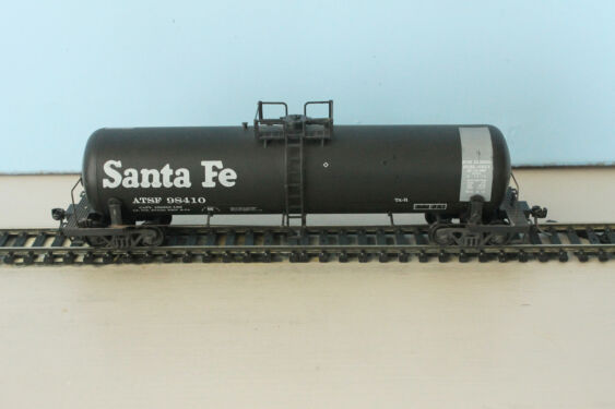 ATSF Tk-R #98410 is a Tk-R tank car built by Richmond Tank Car Co. in 1974. It is shown in the 1980s paint scheme for carrying diesel fuel. Model is by MDC-Roundhouse, Bob Walz photo. ATSF Tk-R #98410 (model)