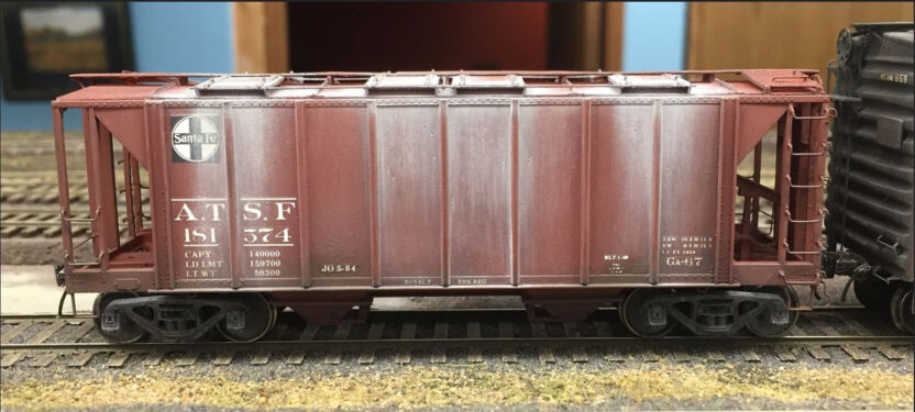 ATSF #181574 is a 1957 cu.ft. capacity Ga-67 class covered hopper built in 1949 by American Car & Foundry. This model and photo are from Chris_Vanko exhibited at an RPM meet. ATSF Ga-67 #181575 (model)
