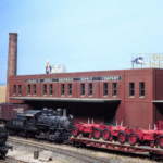 Switcher #9109 shoves a cut of cars thorugh the warehouse district on Bill Van der Meer's Sweetwater & Orient (#1). Bill Van der Meer photo. Model switcher on layout.