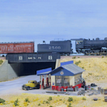 ATSF decapod (2-10-0) #2566 cross the Route 55 overpass with a mixed trained. The Depression era Standard Oil gas station is built up Chooch kit on Bill Van der Meer's Sweetwater & Orient #1. Photo by Bill Van der Meer. Model of ASF #2566