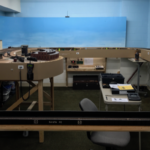 Progress is at about the midway point on Bill Van der Meer's Sweetwater & Orient layout in this photo. It is nice to see that even Master Santa Fe Modelers have work in progress, although this layout room seems overly neat.... Photo of progresson Sweetwater & Orient #2